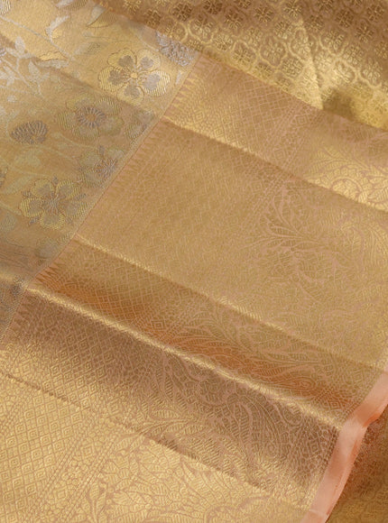 Pure kanchipuram tissue silk saree mild peach shade with allover floral zari woven brocade weaves and zari woven border