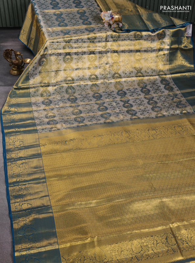 Pure kanchipuram tissue silk saree dual shade of gold and peacock green with allover zari woven brocade weaves and long rich zari woven border