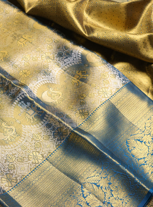 Pure kanchipuram tissue silk saree dual shade of gold and peacock green with allover zari woven brocade weaves and long rich zari woven border