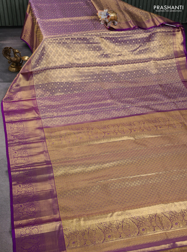 Pure kanchipuram tissue silk saree dual shade of gold and purple with allover zari woven geometric brocade weaves and long rich zari woven border