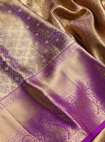 Pure kanchipuram tissue silk saree dual shade of gold and purple with allover zari woven geometric brocade weaves and long rich zari woven border