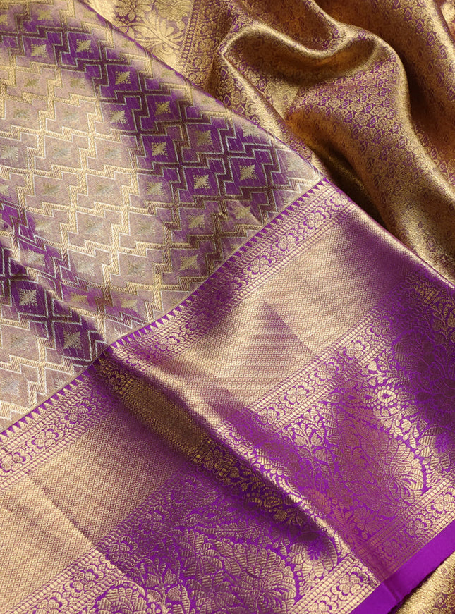 Pure kanchipuram tissue silk saree dual shade of gold and purple with allover zari woven geometric brocade weaves and long rich zari woven border