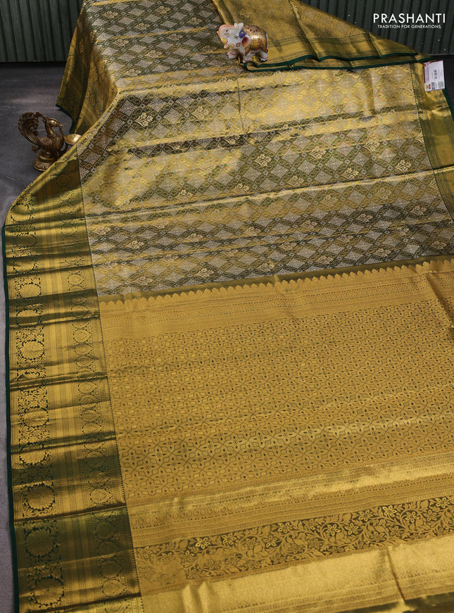 Pure kanchipuram tissue silk saree gold and bottle green with allover zari woven brocade weaves and long rich zari woven floral border