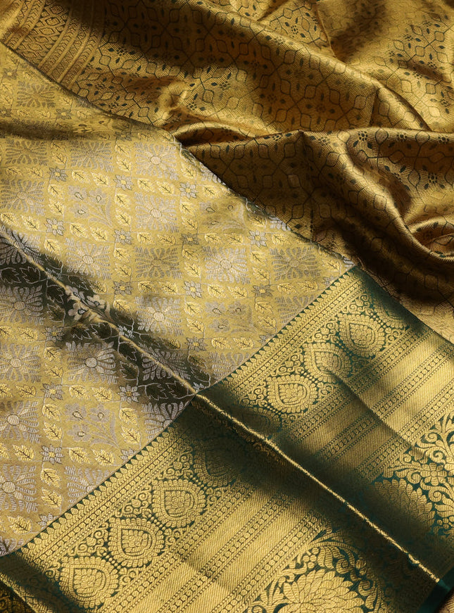 Pure kanchipuram tissue silk saree gold and bottle green with allover zari woven brocade weaves and long rich zari woven floral border