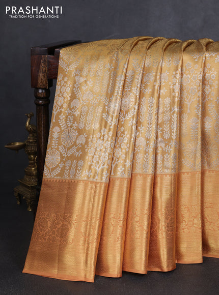 Pure kanchipuram tissue silk saree sandal with allover silver zari woven brocade weaves and long rich zari woven border