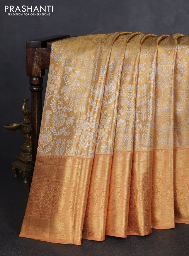 Pure kanchipuram tissue silk saree sandal with allover silver zari woven brocade weaves and long rich zari woven border
