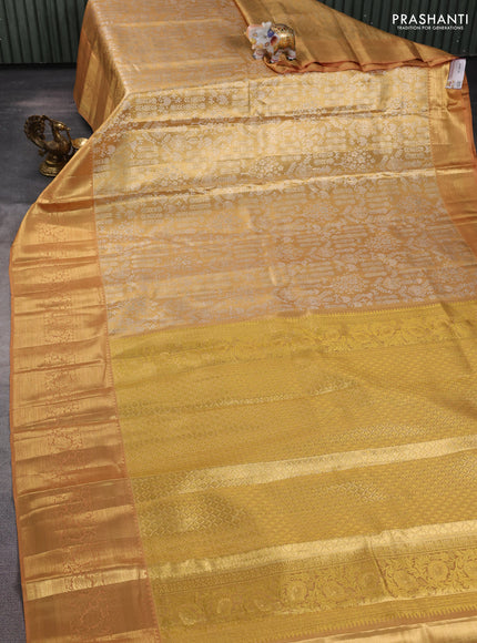 Pure kanchipuram tissue silk saree sandal with allover silver zari woven brocade weaves and long rich zari woven border