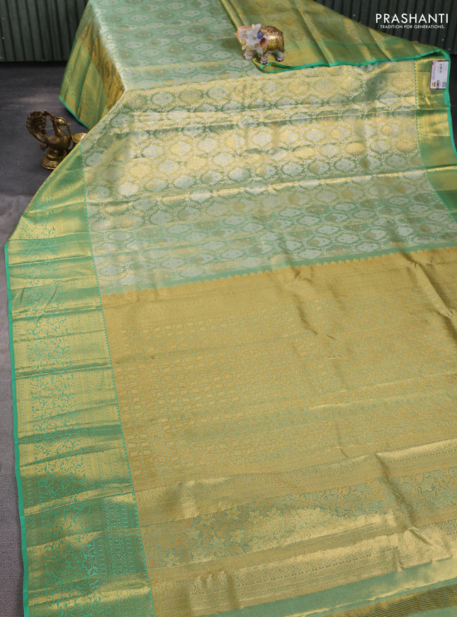 Pure kanchipuram tissue silk saree golden teal and teal green shade with allover zari woven brocade weaves and long rich zari woven border