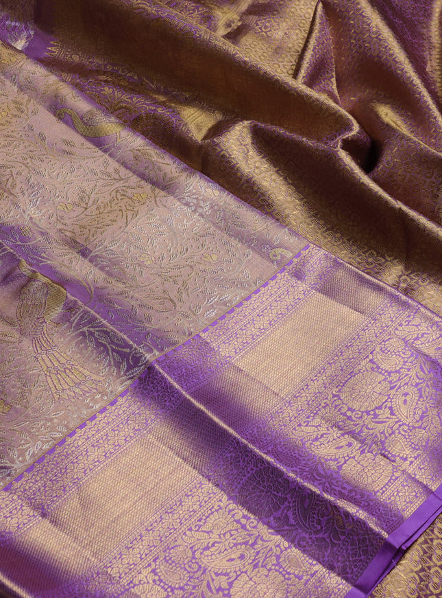 Pure kanchipuram tissue silk saree lavender with allover zari woven brocade weaves and long rich zari woven border