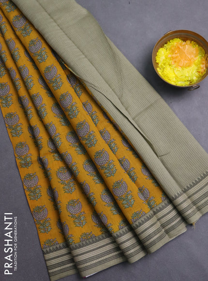 Chanderi silk cotton saree mustard yellow and elaichi green with allover prints and thread woven border