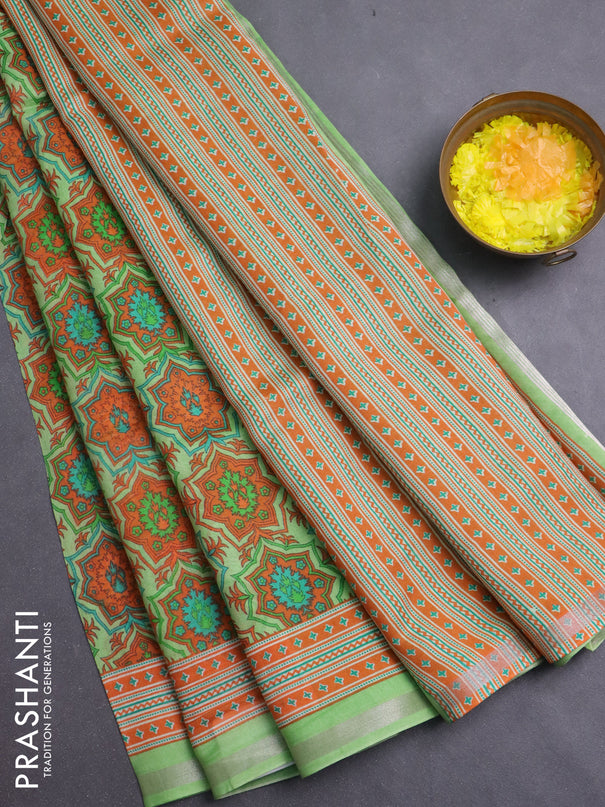 Chanderi silk cotton saree light green and orange with allover prints and zari woven border