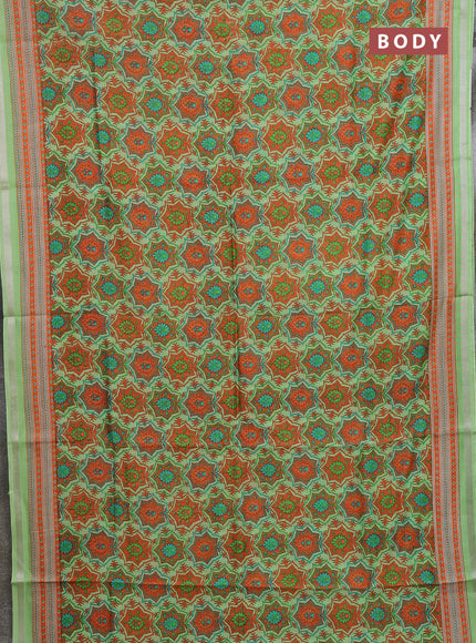 Chanderi silk cotton saree light green and orange with allover prints and zari woven border