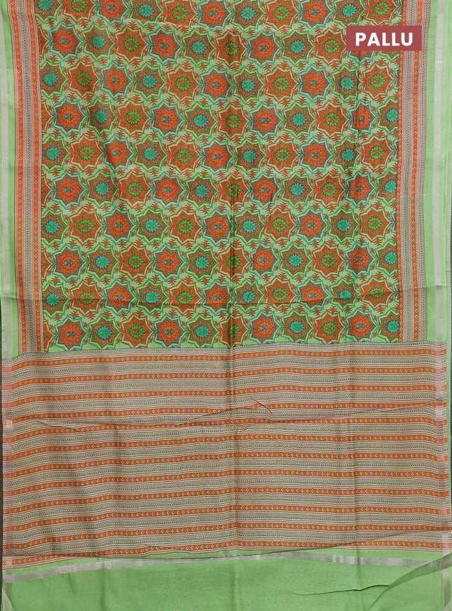 Chanderi silk cotton saree light green and orange with allover prints and zari woven border