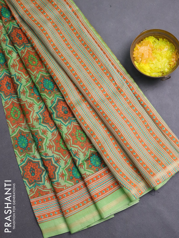 Chanderi silk cotton saree light green and orange with allover prints and zari woven border