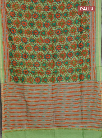 Chanderi silk cotton saree light green and orange with allover prints and zari woven border