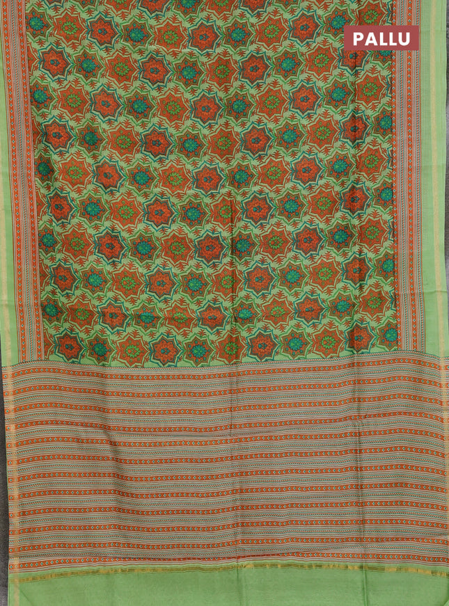 Chanderi silk cotton saree light green and orange with allover prints and zari woven border