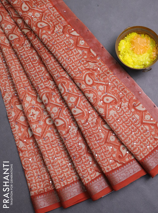 Chanderi silk cotton saree rust shade with allover prints & mirror work and banarasi style border