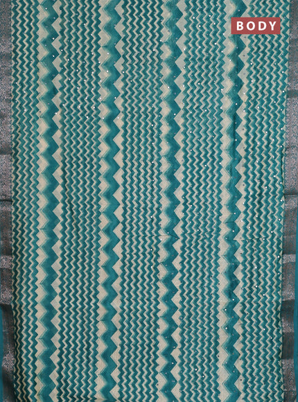 Chanderi silk cotton saree teal green and beige with allover zigzag prints & mirror work and banarasi style border