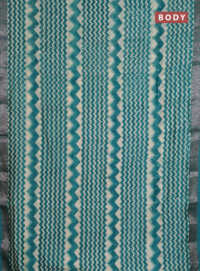 Chanderi silk cotton saree teal green and beige with allover zigzag prints & mirror work and banarasi style border