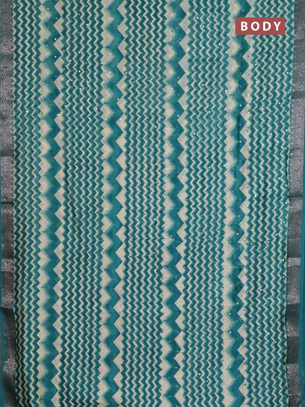 Chanderi silk cotton saree teal green and beige with allover zigzag prints & mirror work and banarasi style border
