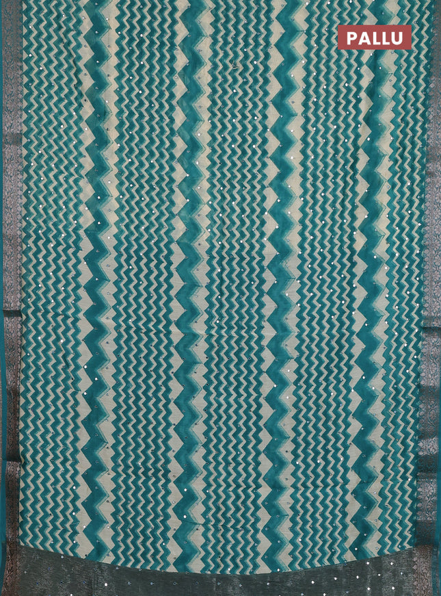Chanderi silk cotton saree teal green and beige with allover zigzag prints & mirror work and banarasi style border