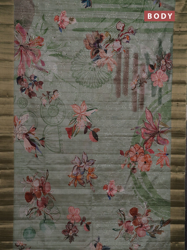 Semi matka saree pastel green with allover floral prints & sequence work and zari woven border