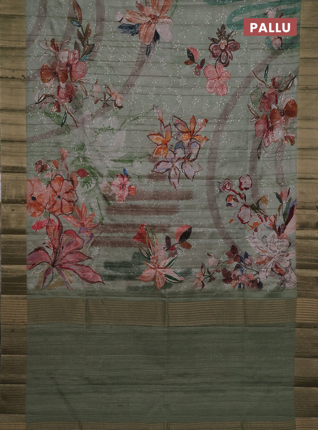 Semi matka saree pastel green with allover floral prints & sequence work and zari woven border