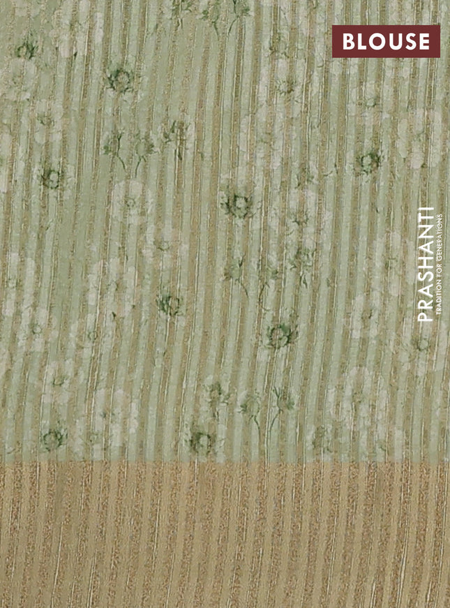 Semi matka saree pista green with allover floral prints & sequence work and zari woven border