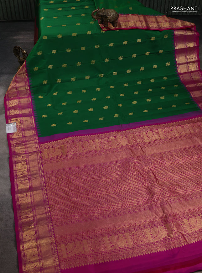 Pure gadwal silk saree green and magenta pink with annam zari woven buttas and temple design zari woven border