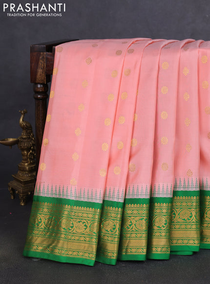 Pure gadwal silk saree mild peach and green with zari woven buttas and temple design zari woven border