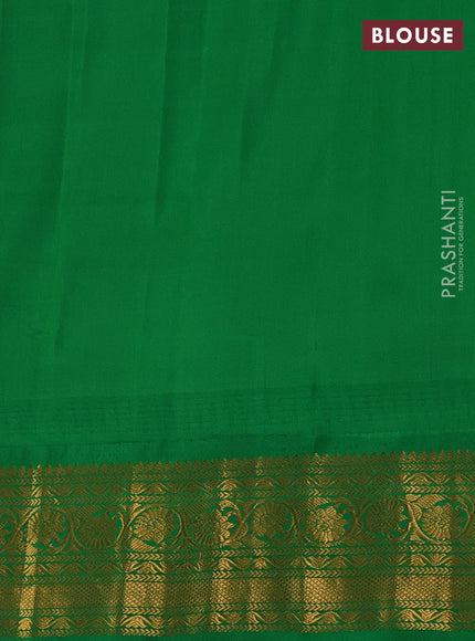 Pure gadwal silk saree mild peach and green with zari woven buttas and temple design zari woven border