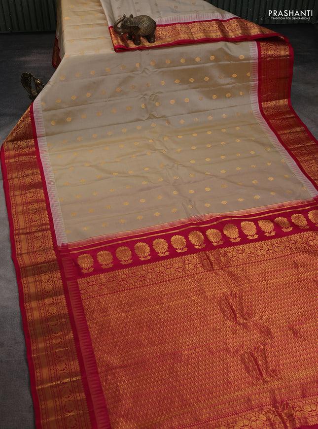 Pure gadwal silk saree beige and pink with allover zari woven buttas and temple design zari woven border