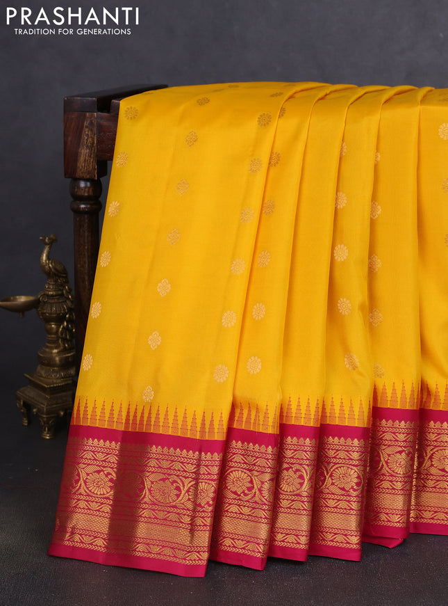 Pure gadwal silk saree mango yellow and pink with allover zari woven buttas and temple design zari woven border