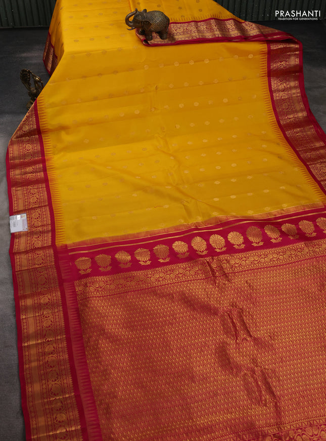 Pure gadwal silk saree mango yellow and pink with allover zari woven buttas and temple design zari woven border