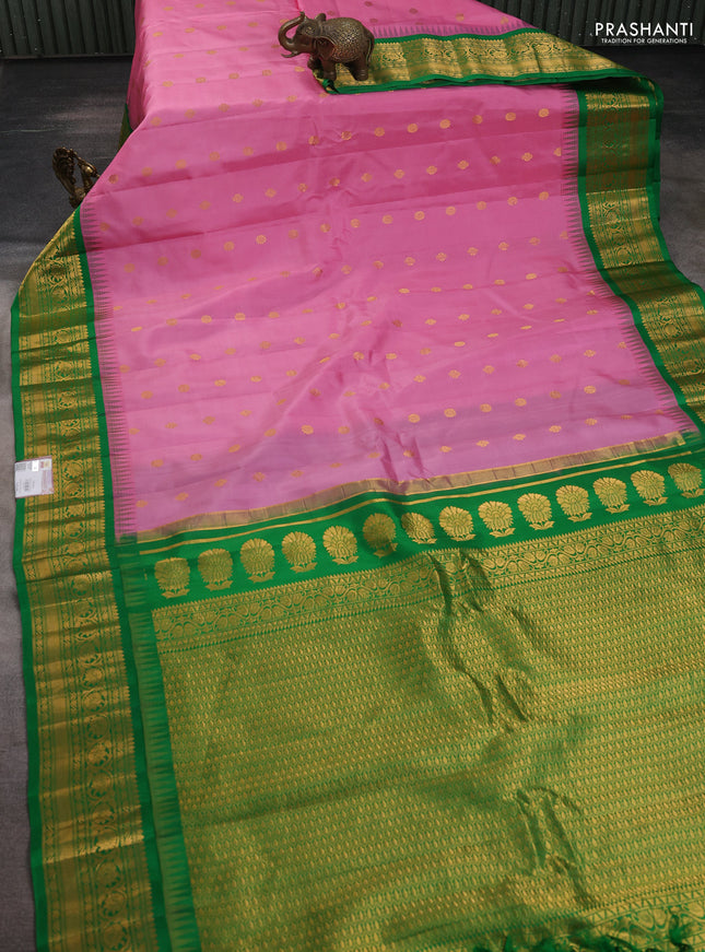 Pure gadwal silk saree light pink and green with allover zari woven buttas and temple design zari woven border
