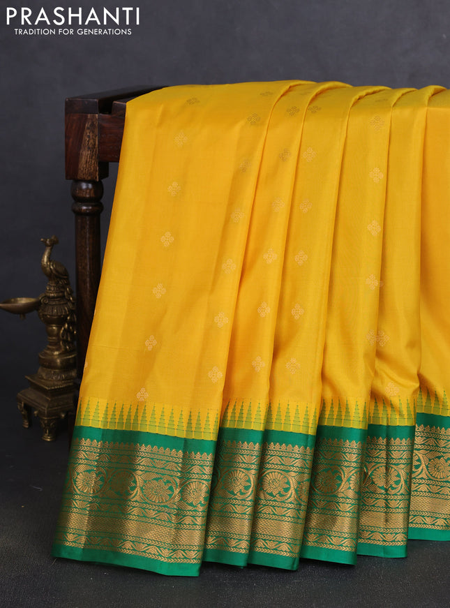Pure gadwal silk saree yellow and green with allover zari woven buttas and temple design zari woven border