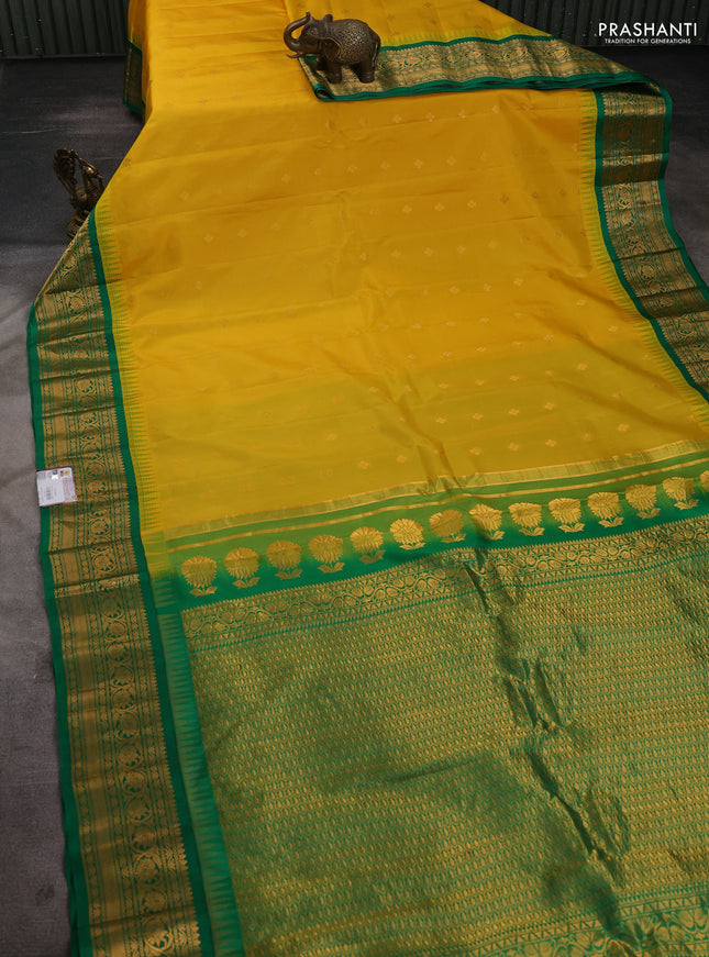 Pure gadwal silk saree yellow and green with allover zari woven buttas and temple design zari woven border