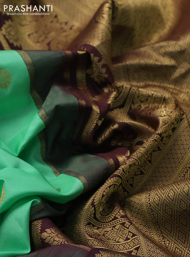 Pure gadwal silk saree teal green shade and coffee brown with zari woven buttas and temple design zari woven border