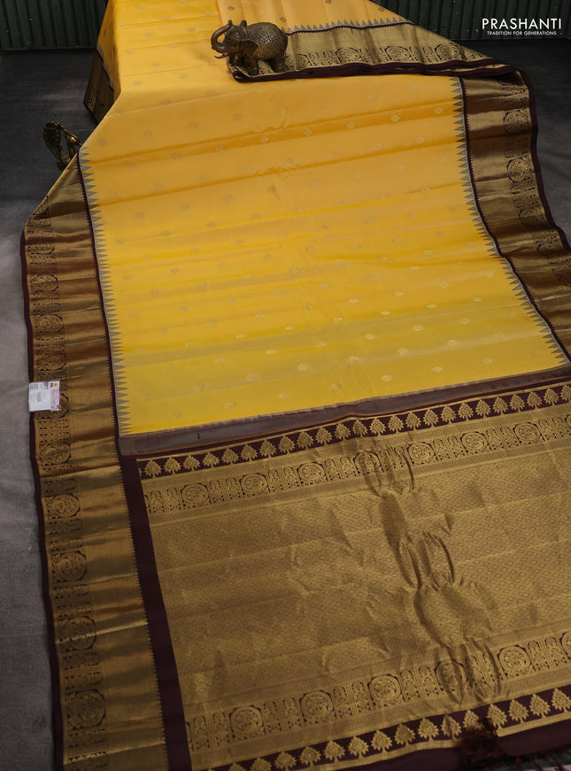 Pure gadwal silk saree yellow shade and coffee brown with zari woven buttas and temple design zari woven border