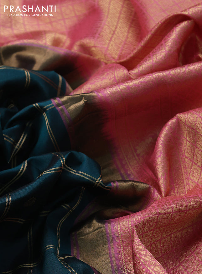 Pure gadwal silk saree peacock green and peach pink with allover zari checks & buttas and temple design zari woven border