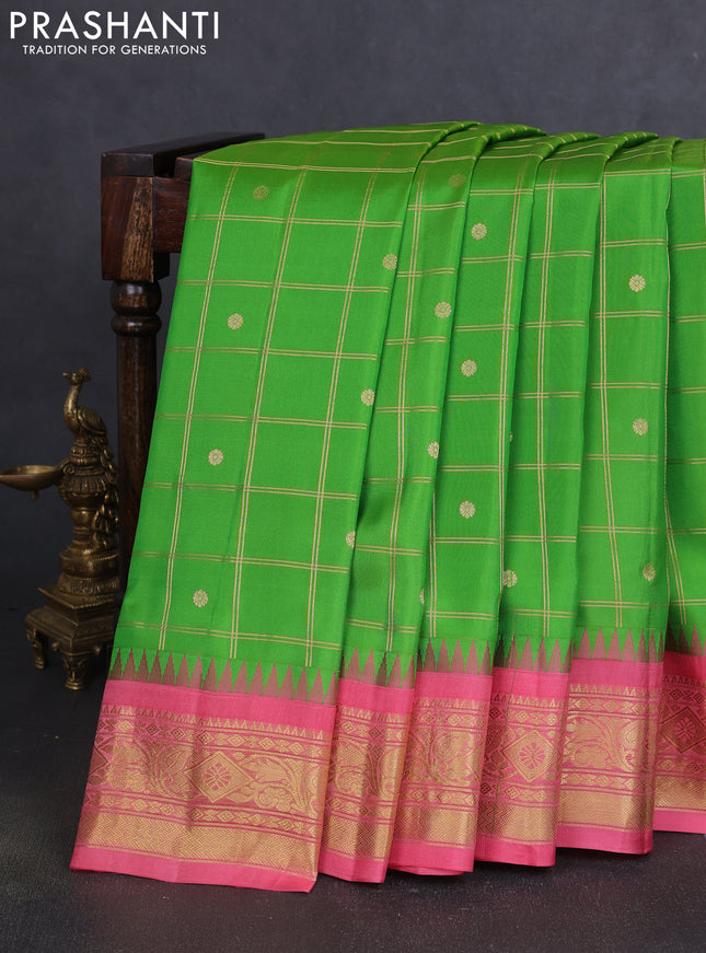 Pure gadwal silk saree parrot green and peach pink with allover zari checks & buttas and temple design zari woven border