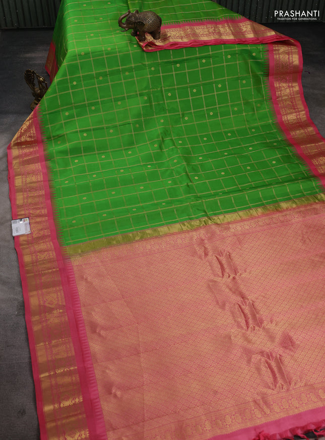 Pure gadwal silk saree parrot green and peach pink with allover zari checks & buttas and temple design zari woven border