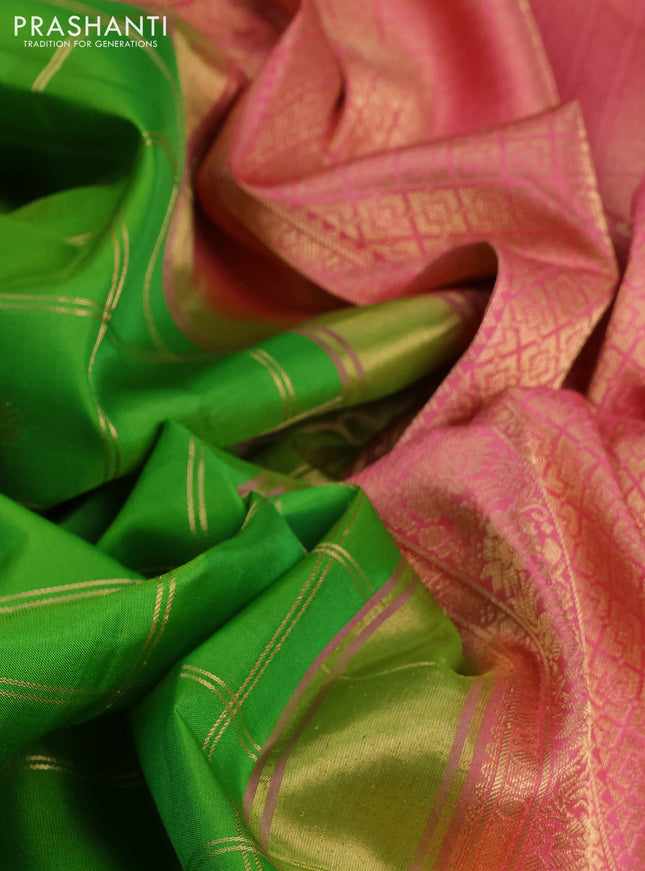 Pure gadwal silk saree parrot green and peach pink with allover zari checks & buttas and temple design zari woven border