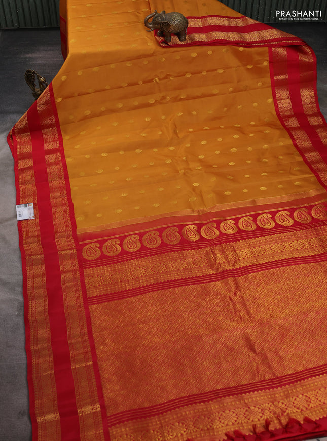 Pure gadwal silk saree dark mustard and red with zari woven buttas and rettapet zari woven border