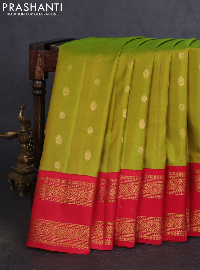 Pure gadwal silk saree dual shade of light green and red with zari woven buttas and temple design zari woven border