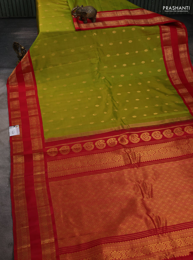 Pure gadwal silk saree dual shade of light green and red with zari woven buttas and temple design zari woven border