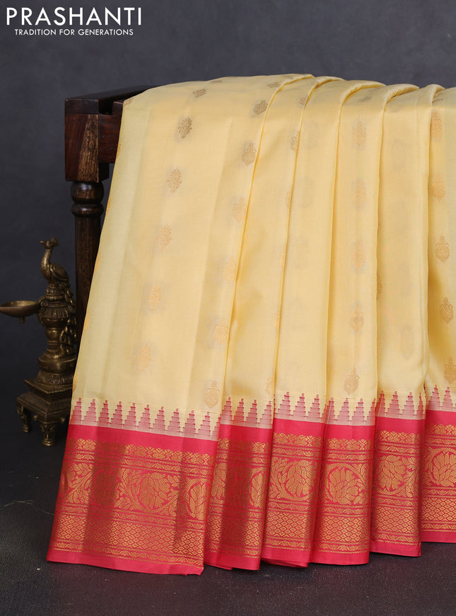 Pure gadwal silk saree pale yellow and red with zari woven buttas and temple design zari woven border