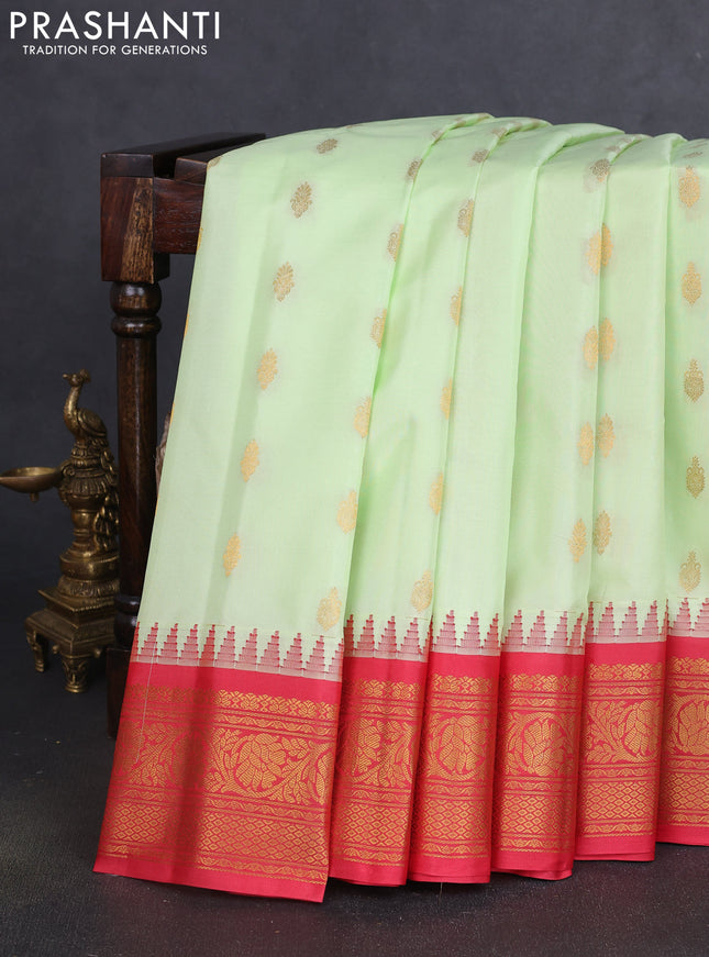 Pure gadwal silk saree mild pista green and red with zari woven buttas and temple design zari woven border