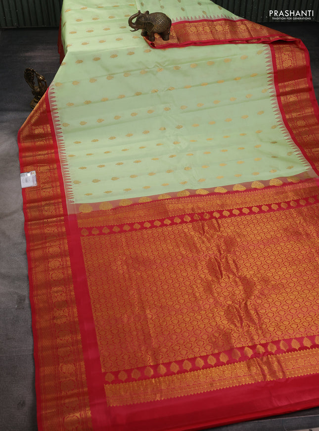 Pure gadwal silk saree mild pista green and red with zari woven buttas and temple design zari woven border