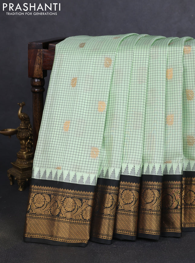 Pure gadwal silk saree pista green and black with allover zari checks & buttas and temple design zari woven border